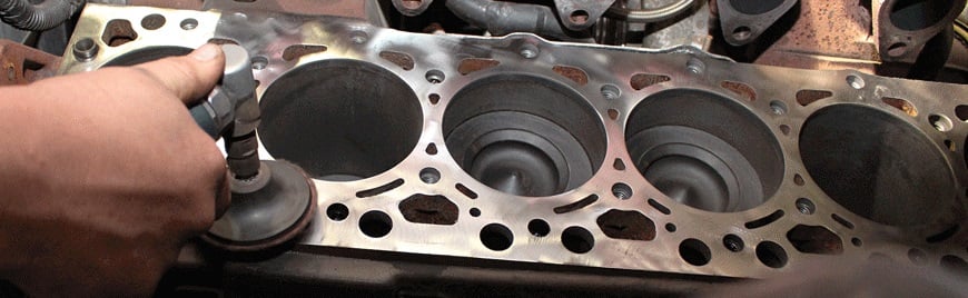 overhead view of someone working on a 6.7L Cummins engine