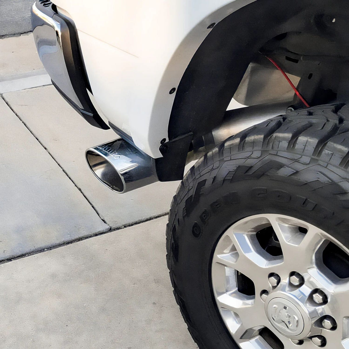 Close-up of Banks chrome-plated stainless steel SideKick exhaust tip with rolled edge and ob-round design