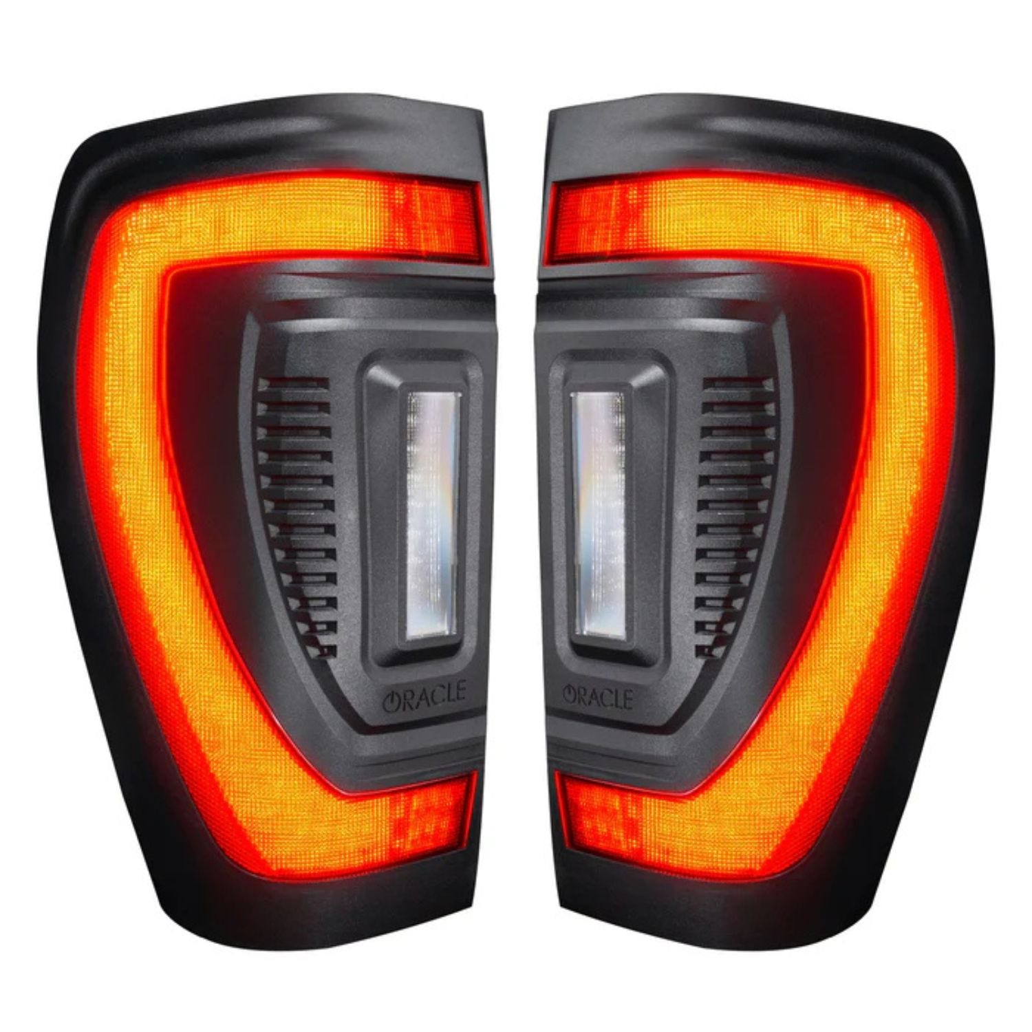 High output reverse lights on GMC Sierra tail lights illuminating dark area behind truck at night