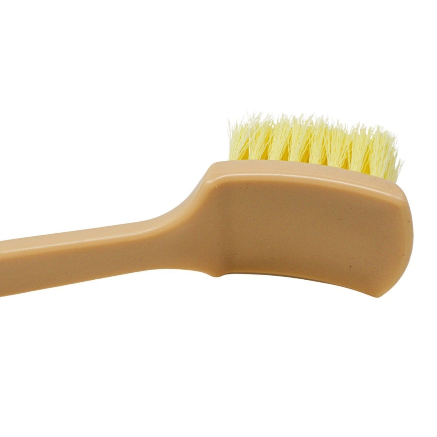 Beige brush with yellow bristles on a white background
