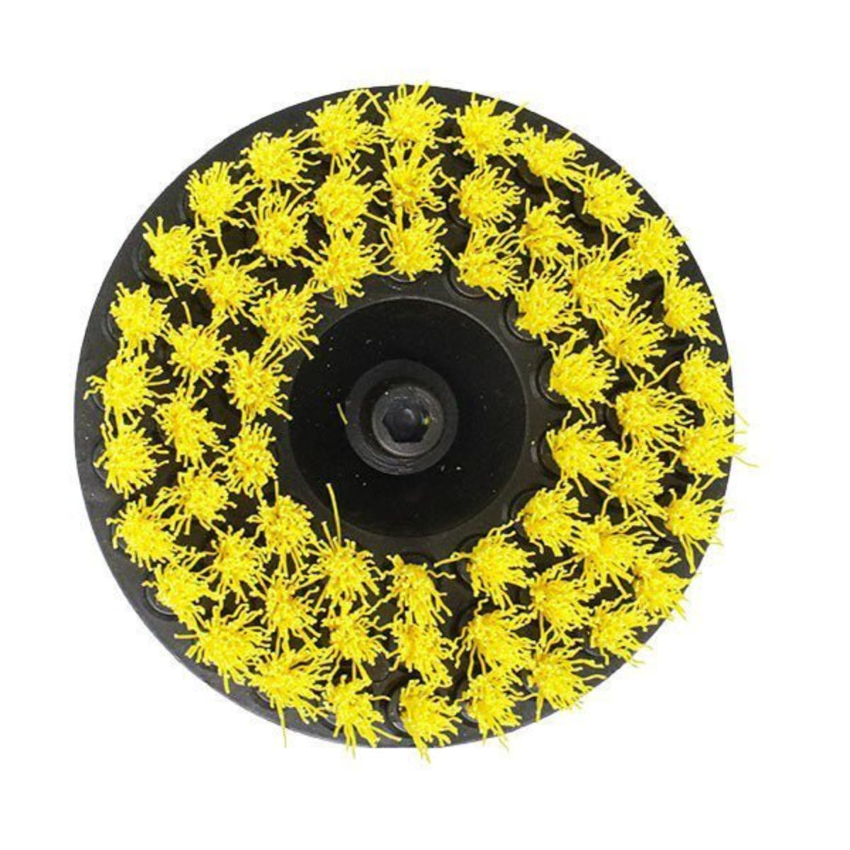 Round brush with yellow bristles on a black background