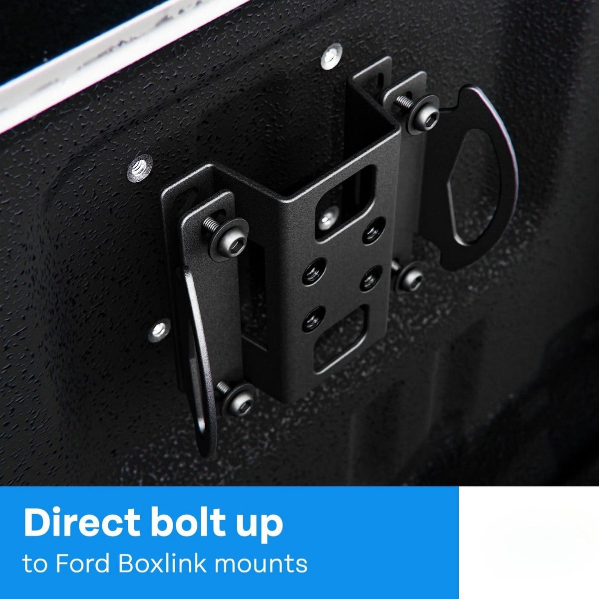 Black powder-coated Ford BoxLink plate with integrated MOLLE mounting holes
