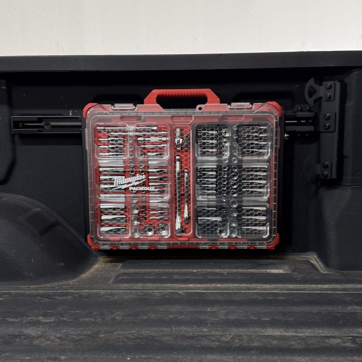 Full-size Packout panel mounted to the Integral front rail on a 2020-2026 GM HD truck