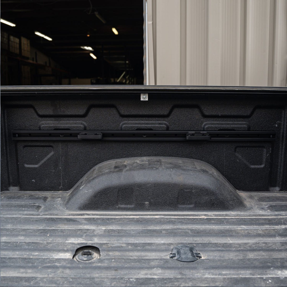 Slide-N-Lock tie-down cleat mounted on an Integral Truck Rail