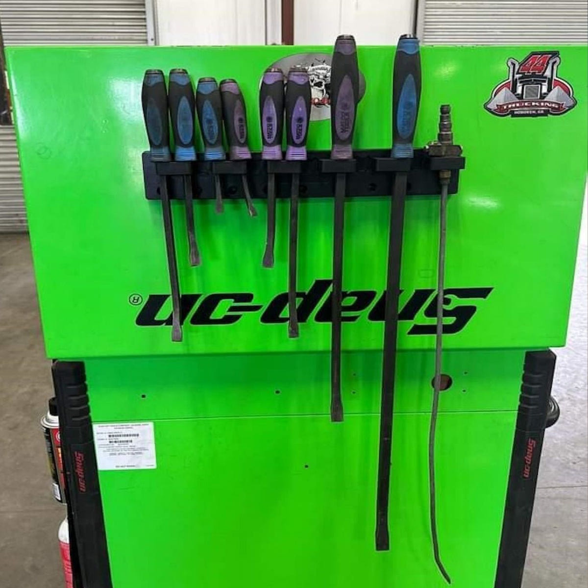 Wall-mounted ToolHanger magnetic storage system for pliers, tape measures, and scissors