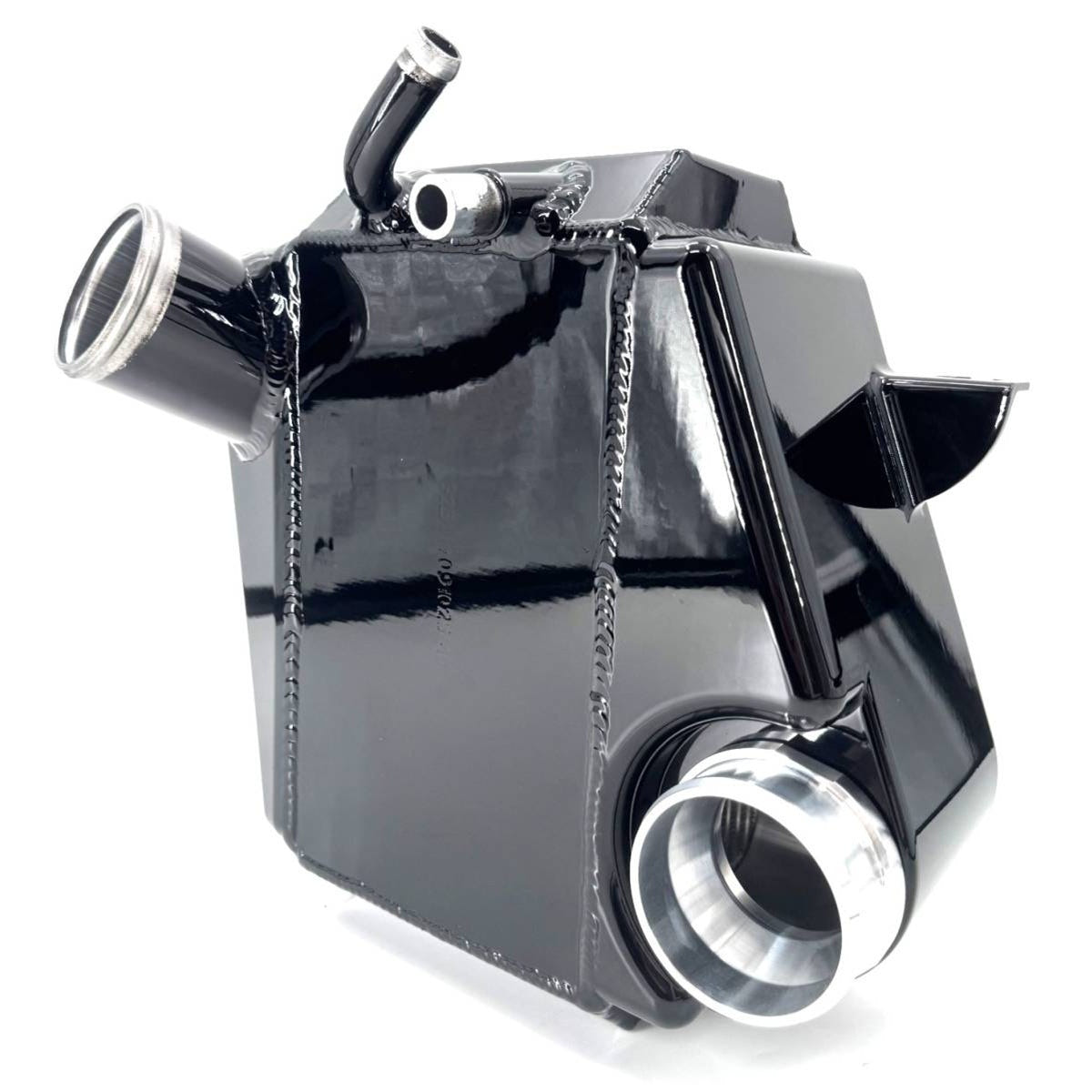 A glossy black aluminum radiator core with silver metal inlet and outlet pipes, shown on a clean white background.