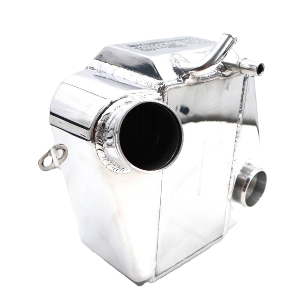 A polished aluminum engine block or radiator component with a highly reflective chrome finish, featuring a large circular opening on the side and a small loop on the opposite side, shown against a plain white background.