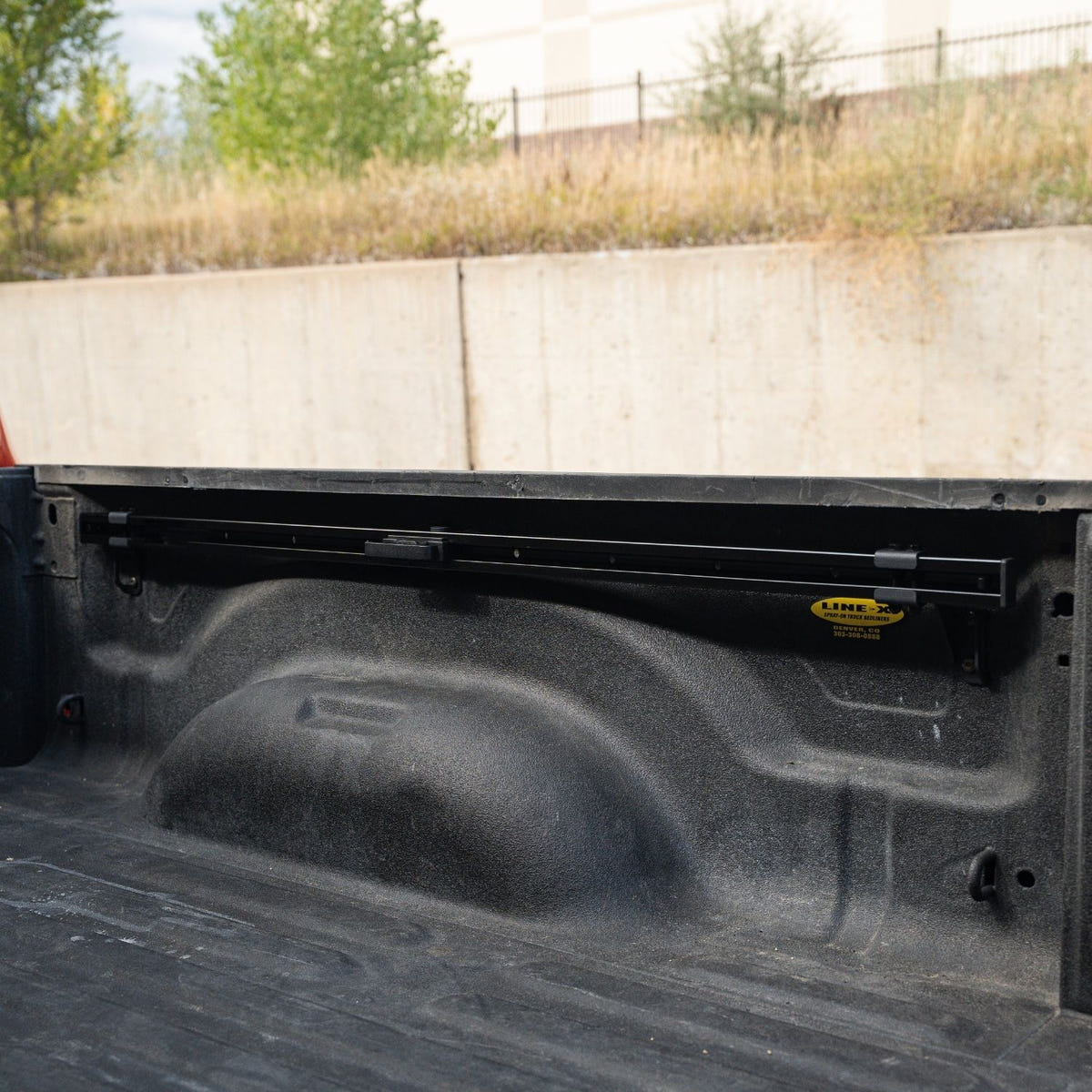Adjustable cargo tie-down cleats installed on Integral bed rails for a 2019-2026 Ram HD truck