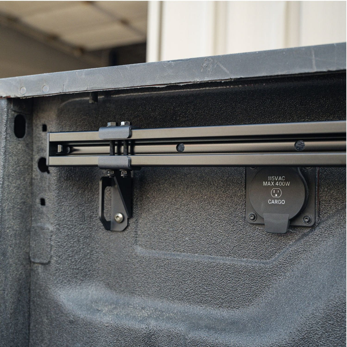 Integral cargo management rail system for a 2019-2026 Ram 2500 6-foot 4-inch bed