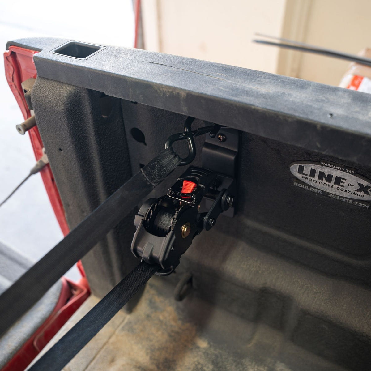 Ram HD truck bed swivel strap with retractable cargo tie-down system
