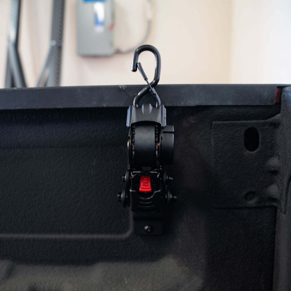 Low-profile Integral Swivel Strap stored against Ram truck bedside