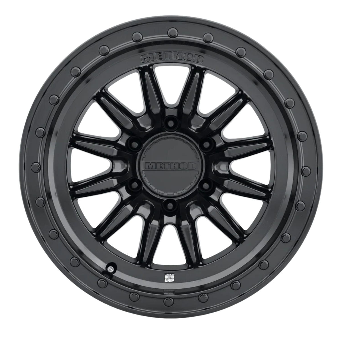Close-up of Method 711-HD Bead Grip wheel showcasing replaceable 12-point lip bolts and center cap